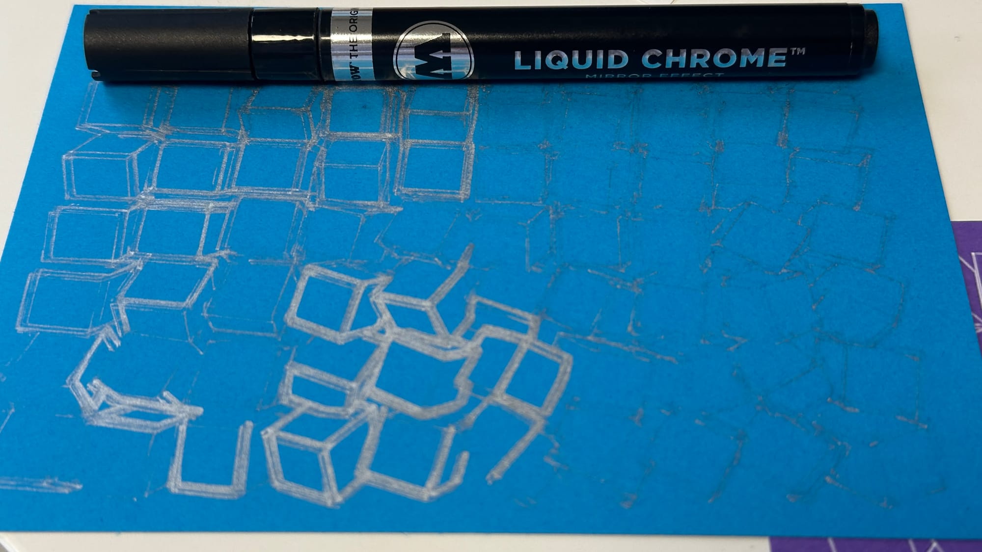 Blue postcard with drawing that starts to fade away as the pen stops drawing